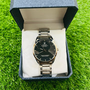 Watch in a blue box on a green grass background