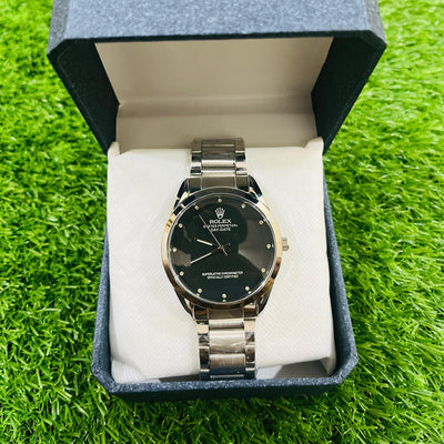 Watch in a blue box on a green grass background