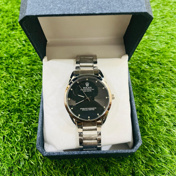 Watch in a blue box on a green grass background