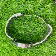 Clear plastic object on green grass