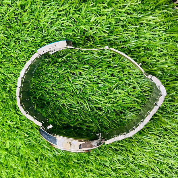 Clear plastic object on green grass